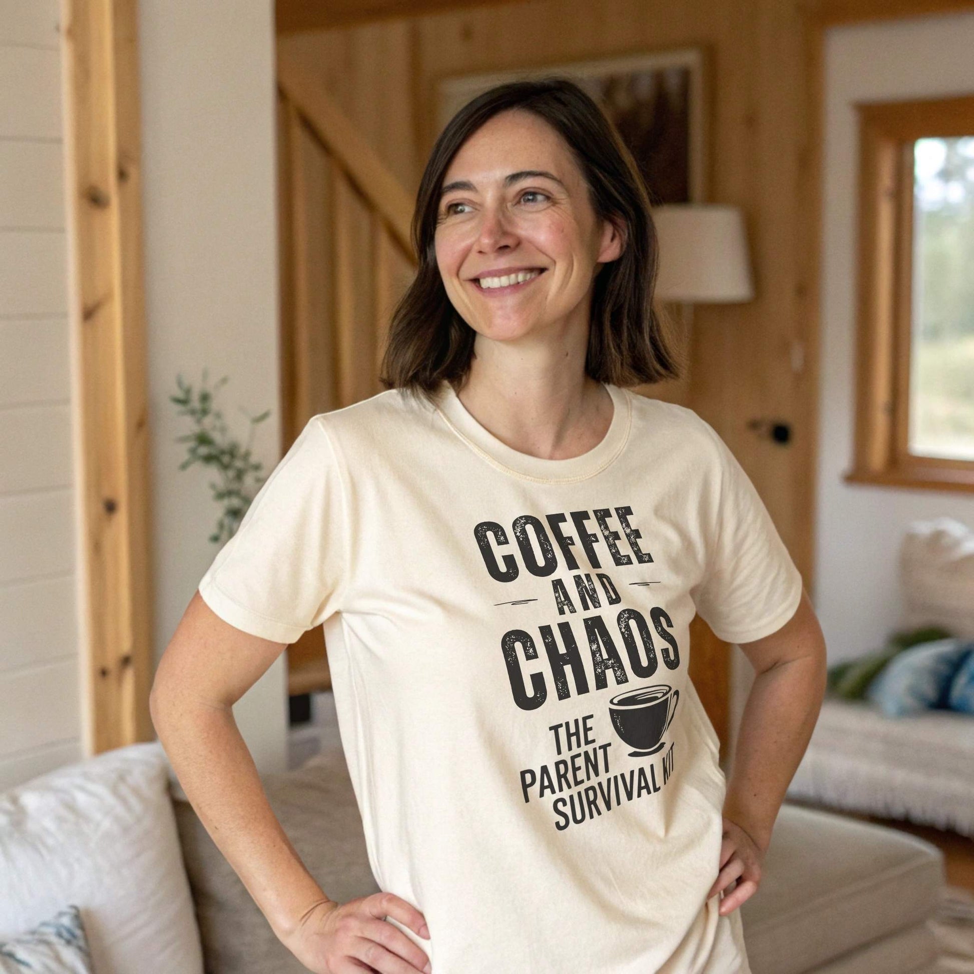 A smiling mom in a Soft Cream ParentingLOL "Coffee and Chaos" t-shirt, representing relatable parent humor and comfortable, expressive clothing.