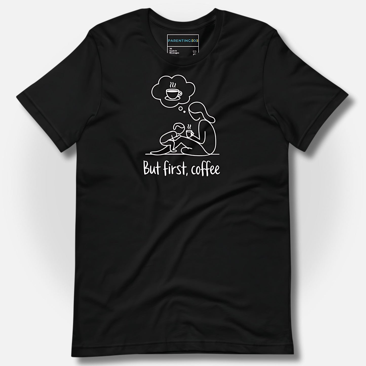 Detail of ParentingLOL's black t-shirt, showcasing the "But first, coffee" design, perfect for a tired, relatable parent needing a laugh.