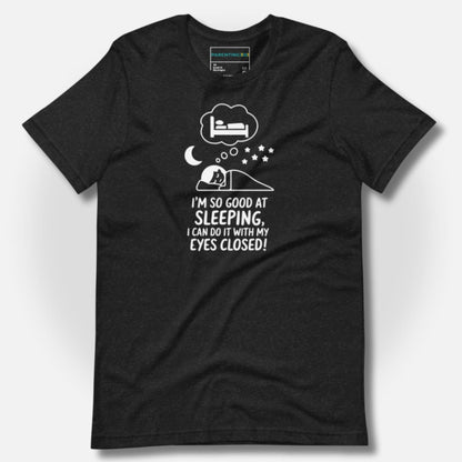 Durable heather black t-shirt with a humorous sleeping parent graphic and "I'm so good at sleeping, I can do it with my eyes closed!" text for funny parenting moments.
