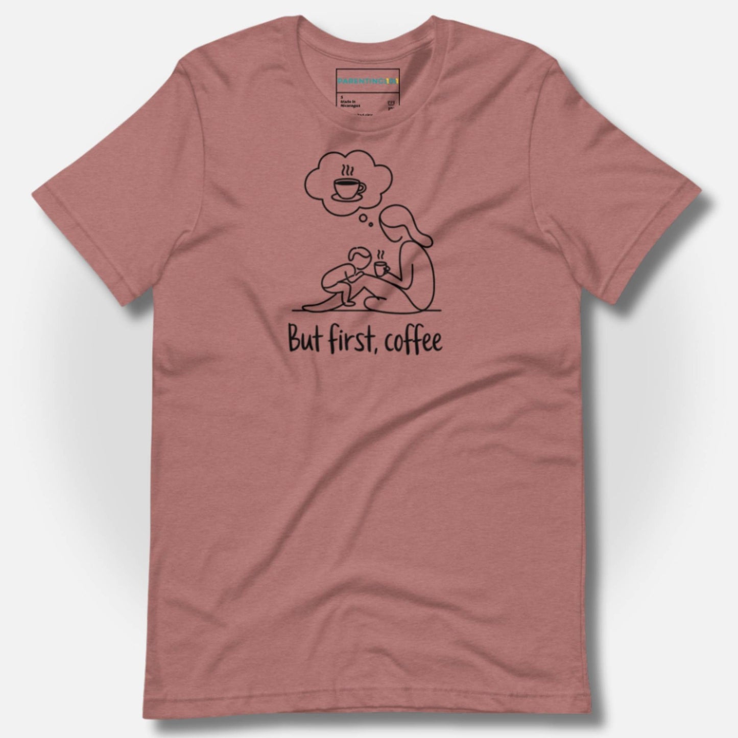 Detail of ParentingLOL's heather mauve t-shirt, with the "But first, coffee" design, highlighting soft comfort for daily parent struggles.