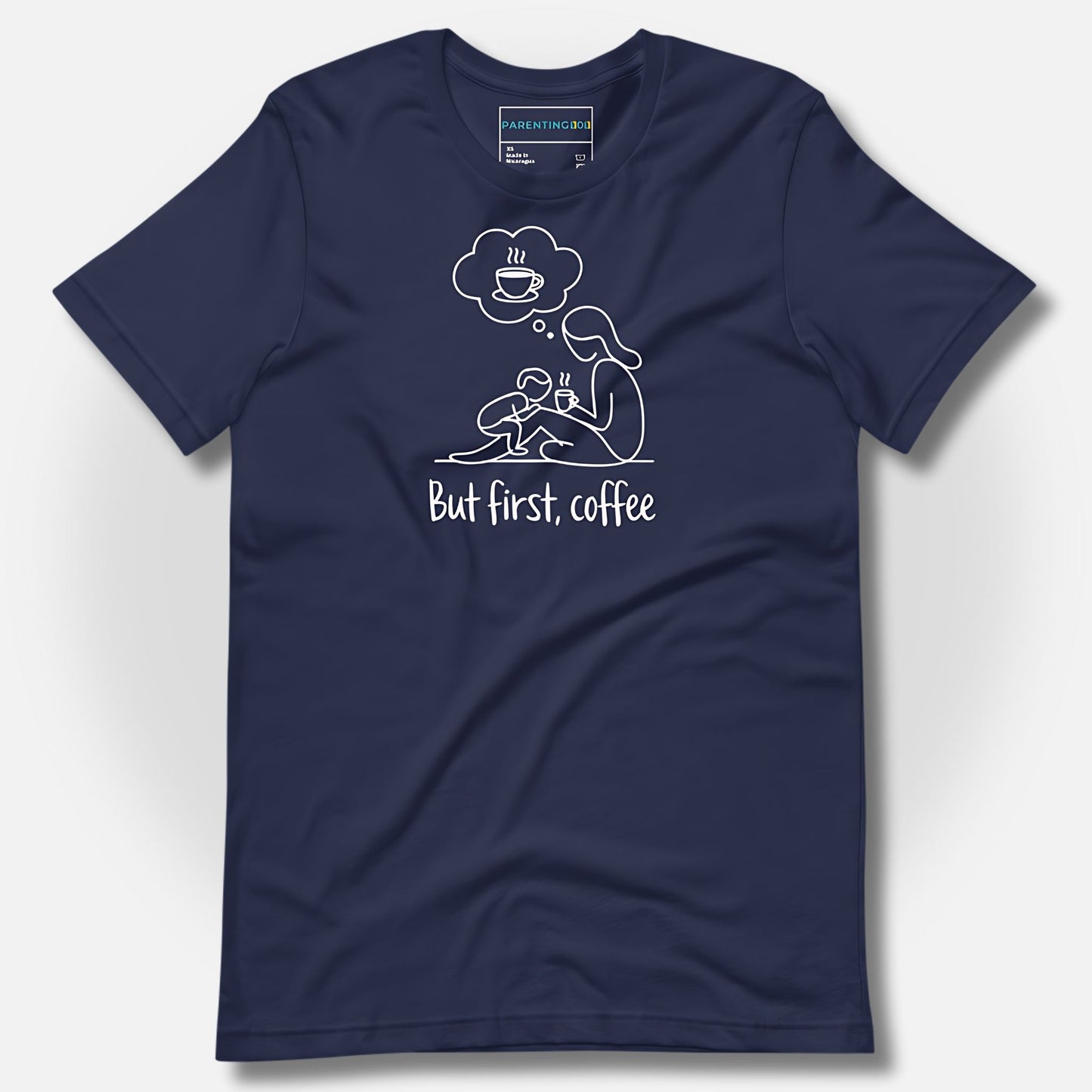 Detail of ParentingLOL's navy t-shirt, displaying the "But first, coffee" design, a soft and durable tee for authentic parent humor.