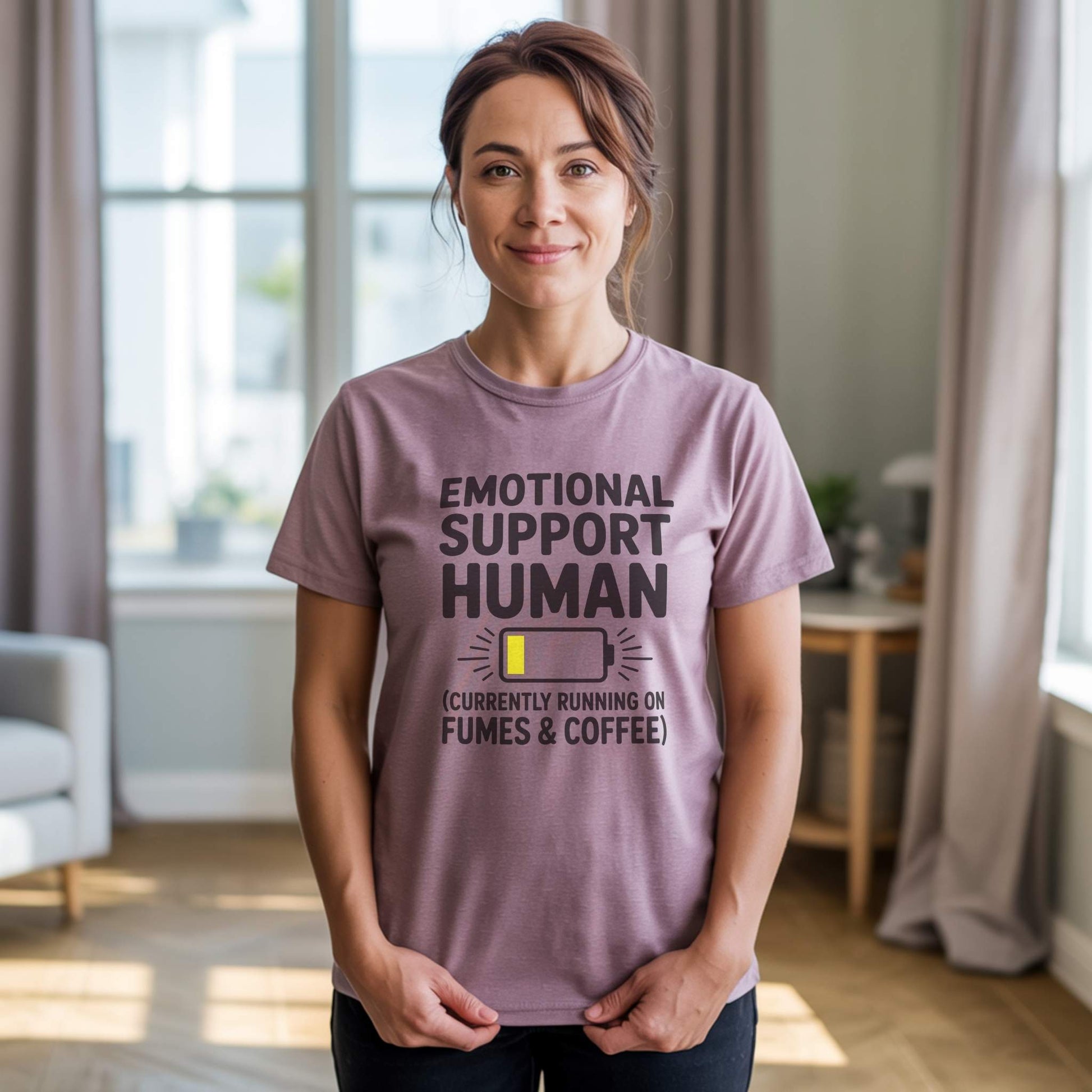 Product Hero Shot - Heather Mauve Tee; Female model wearing a Heather Mauve "Emotional Support Human" t-shirt, embracing lighthearted parent struggles and self-care.