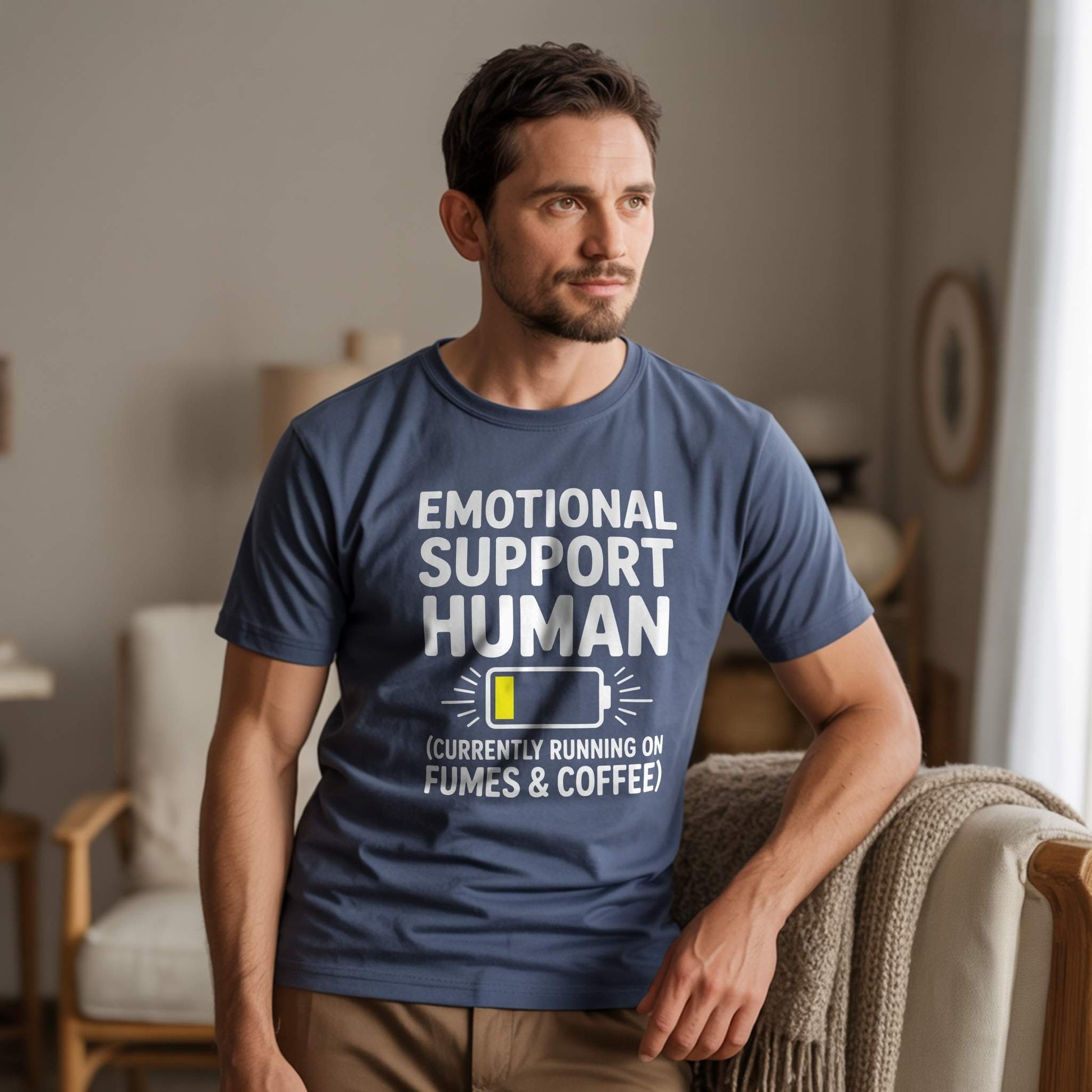 Product Hero Shot - Navy Tee; Male model wearing a Navy "Emotional Support Human" t-shirt, conveying relatable dad life humor and relaxed comfort.