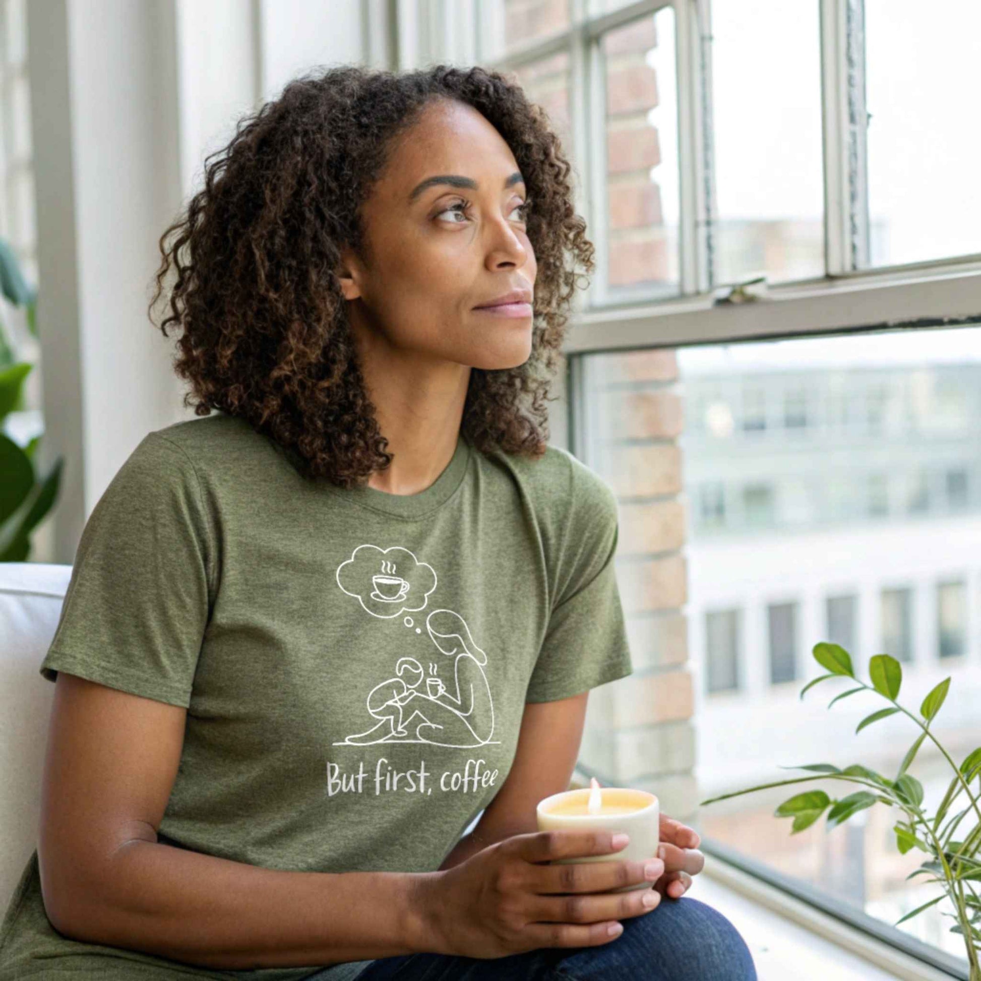 ParentingLOL Hero Shot: Mom in a heather olive "But first, coffee" tee, reflecting on parent struggles and finding joy in parenting humor.