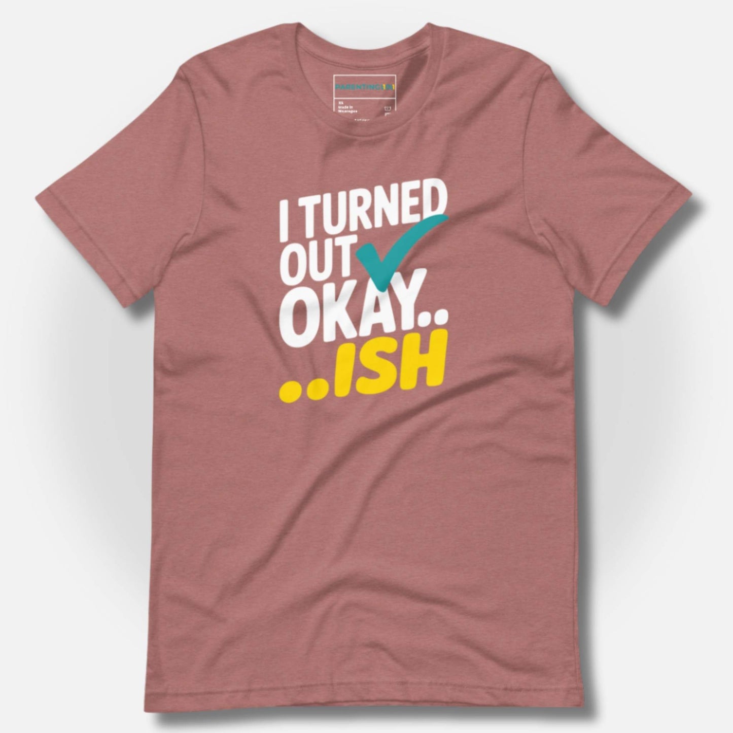 Heather Mauve t-shirt featuring "I Turned Out Okay...ish" in white, teal, and yellow, for relatable parent humor.