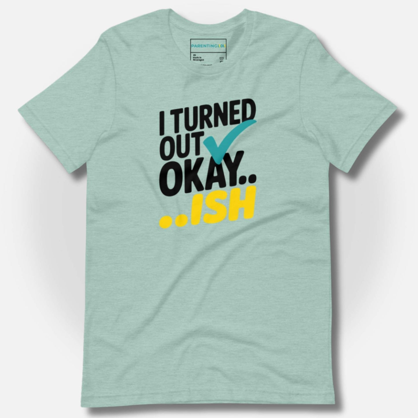 Heather Prism Dusty Blue t-shirt with "I Turned Out Okay...ish" design, a lighthearted nod to real parenting.