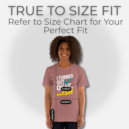 Woman wearing a Heather Mauve t-shirt with "I Turned Out Okay...ish" design, showing measurement guides for shirt fit.