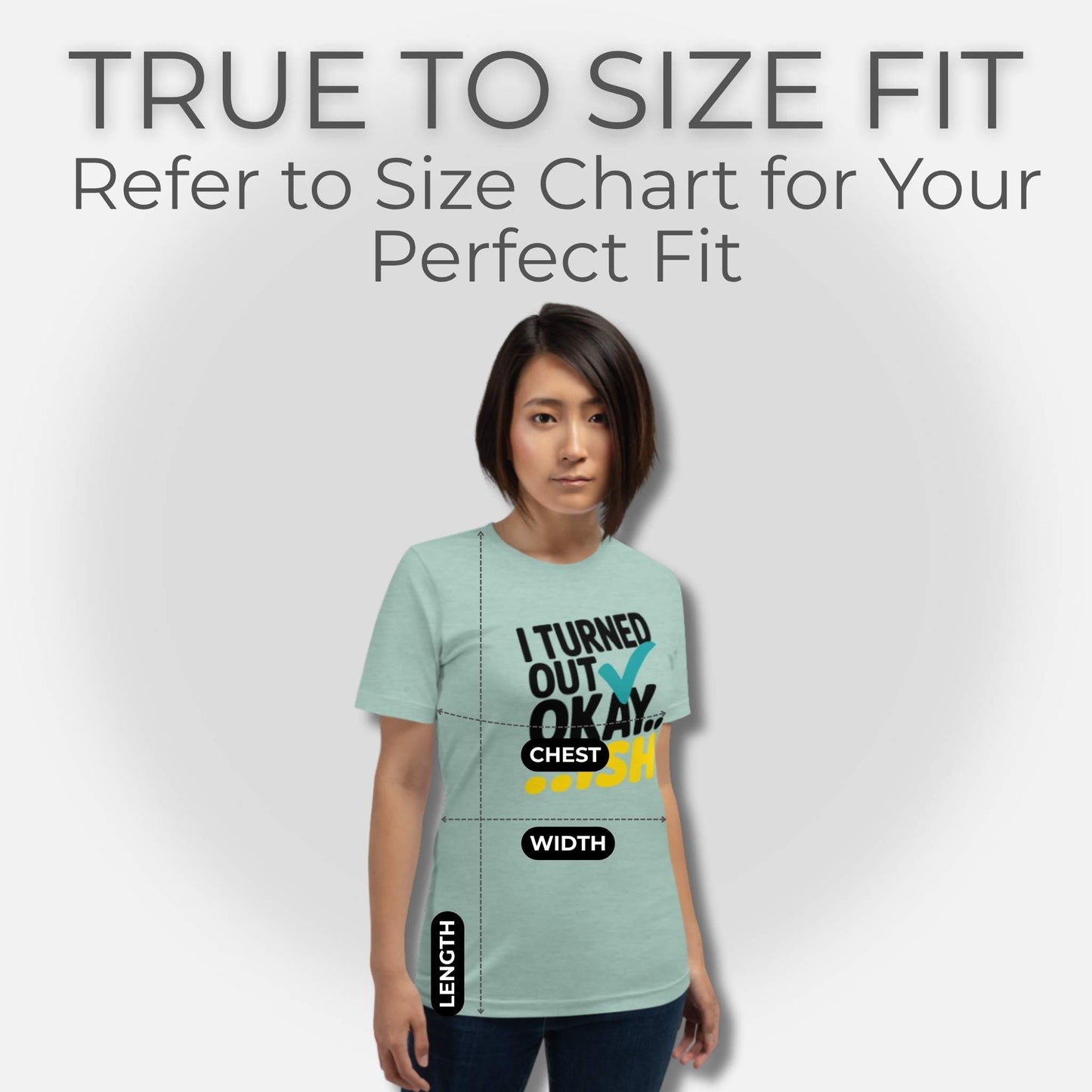 Woman in a Heather Prism Dusty Blue t-shirt with "I Turned Out Okay...ish" design, demonstrating how to measure for fit.