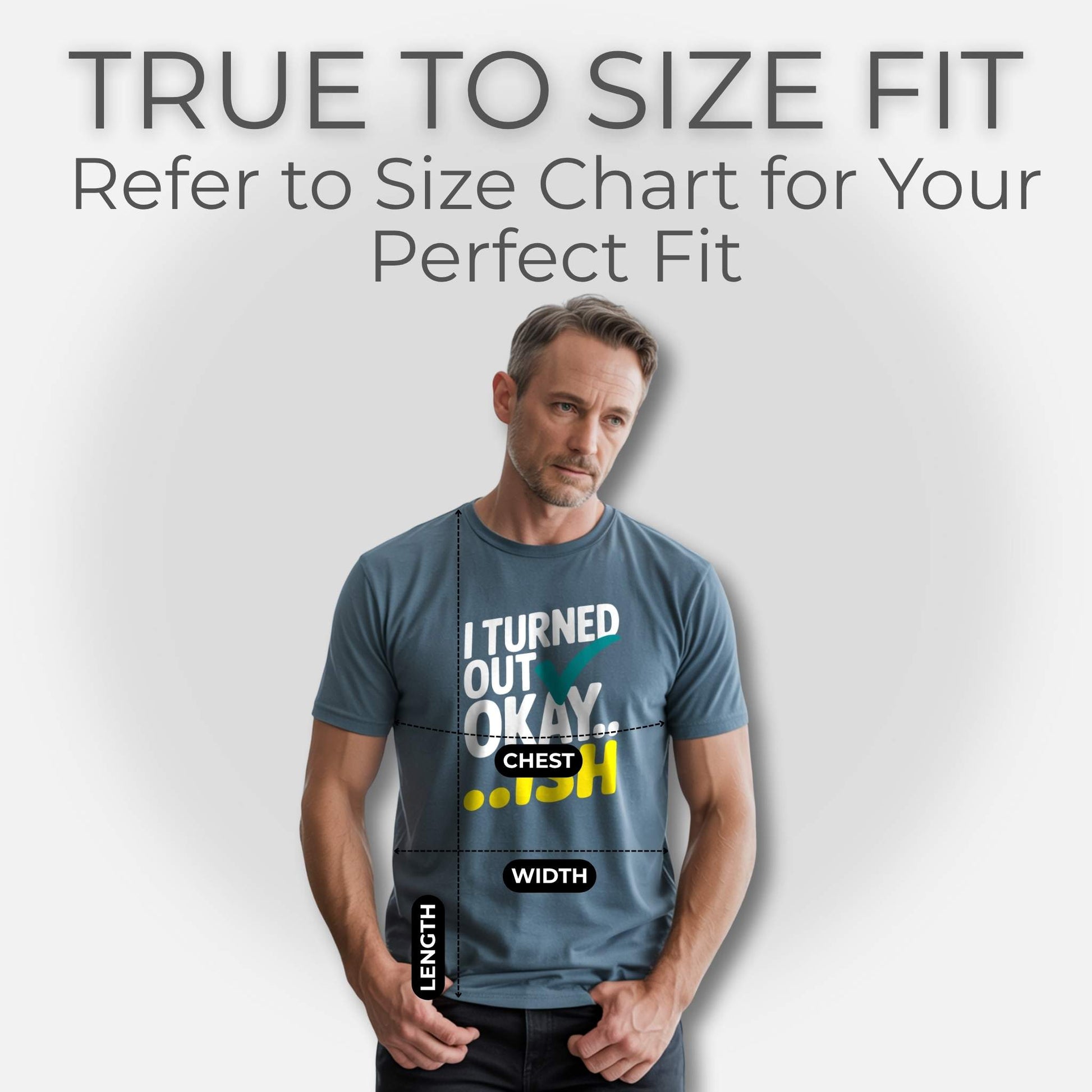 Man in a Heather Slate t-shirt with "I Turned Out Okay...ish" design, illustrating chest, width, and length for accurate sizing.